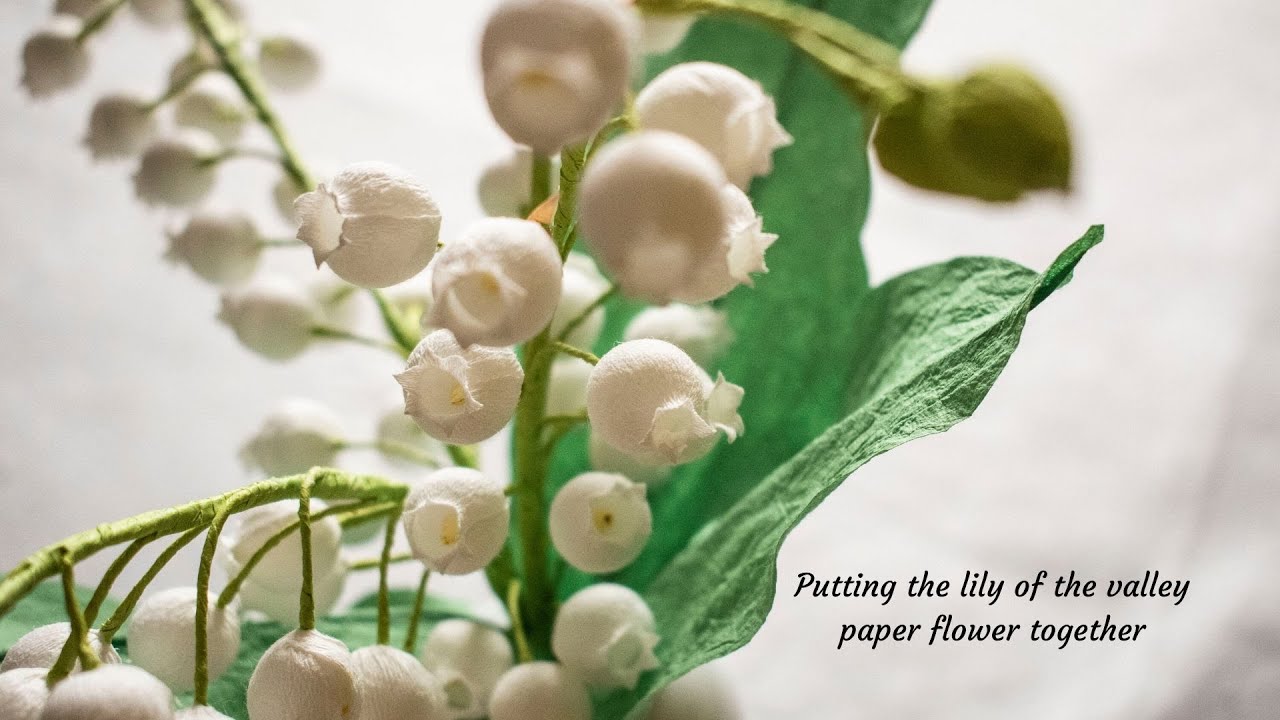 Putting the lily of the valley paper flower together