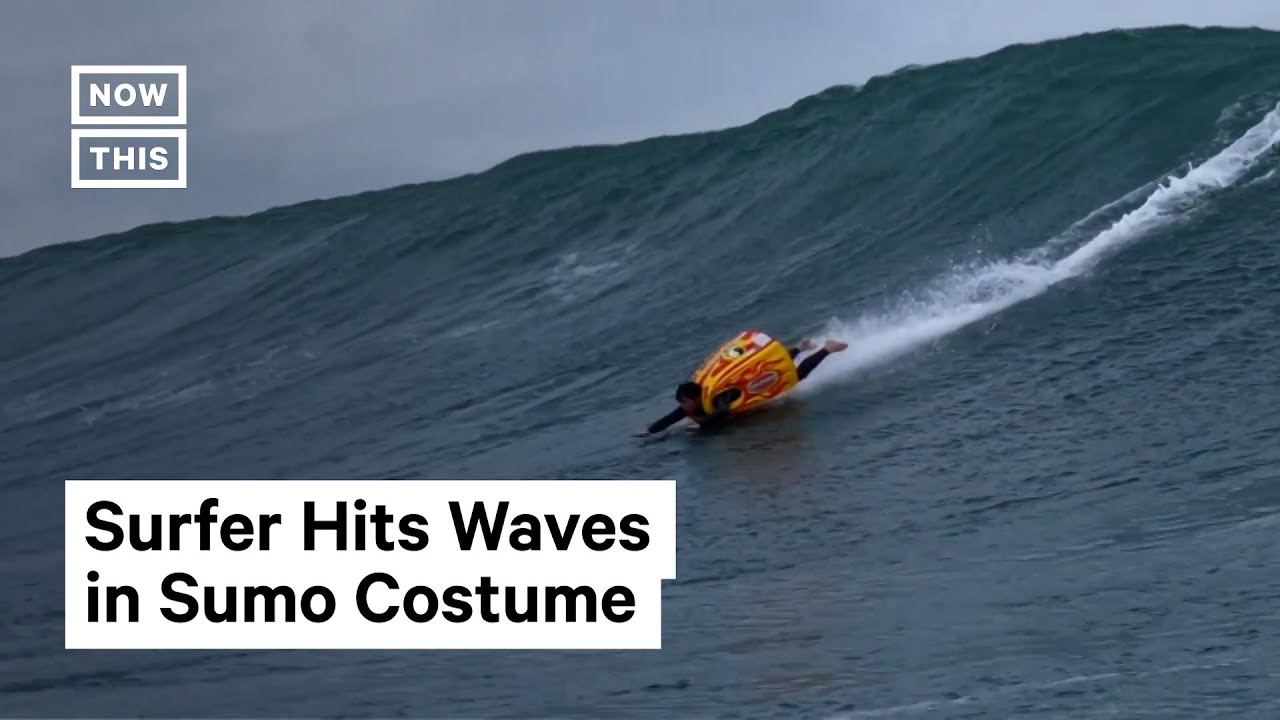 Man Surfs in Sumo Costume #Shorts