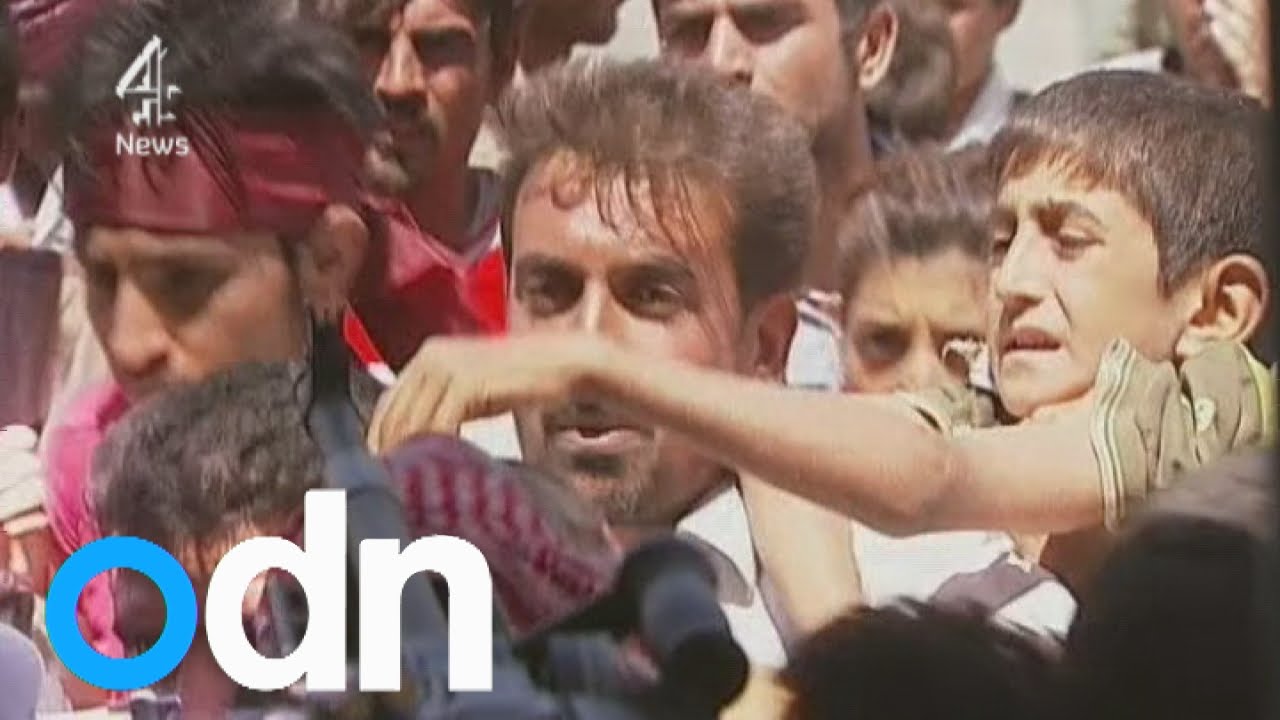 Desperate Yazidis mob helicopter in dramatic rescue mission