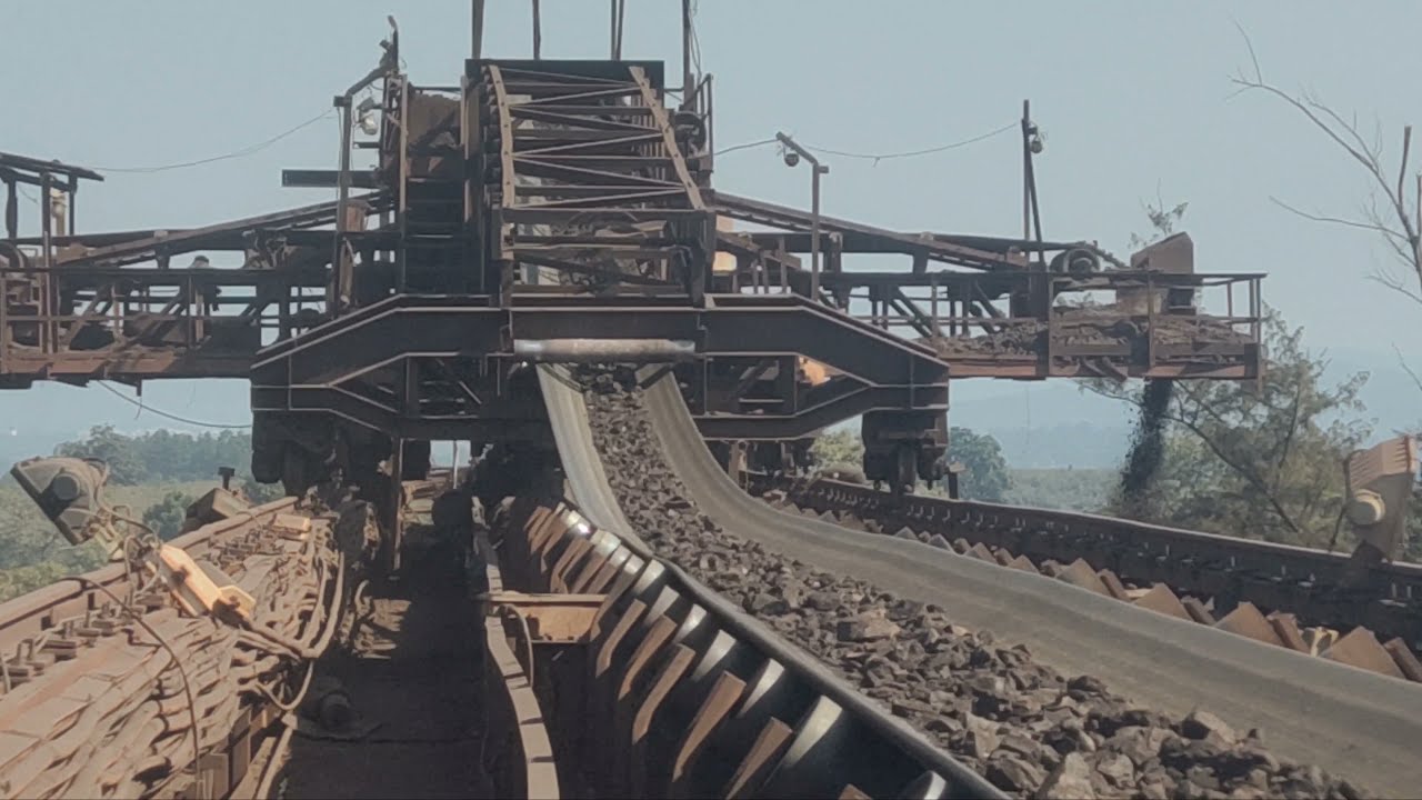 Belt conveyor carrying iron ore ll crushed iron ore carried by belt conveyor