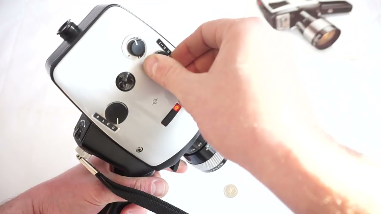 Bauer Royal 10 loading Super 8 film and batteries on Super 8 camera Bauer C Royal 10 E super 8 cam