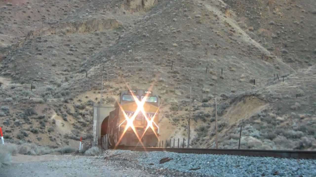 UP blasts out of Carlin tunnel near Elko Nevada. Knocks over Tripod!
