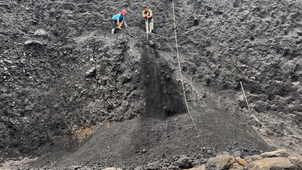 Rockman and Sandman dig black sand with great ease