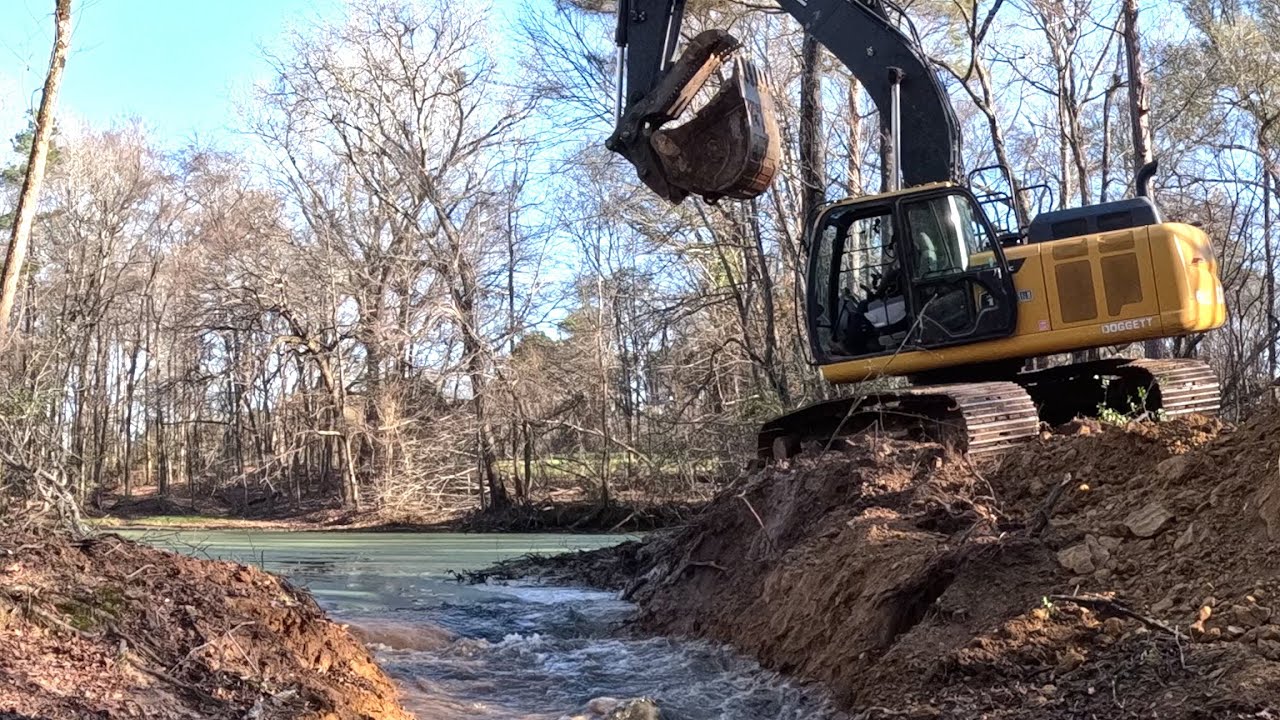 Breaking the dam and draining a pond built 70 years ago. Kicking off the 1950 pond project.