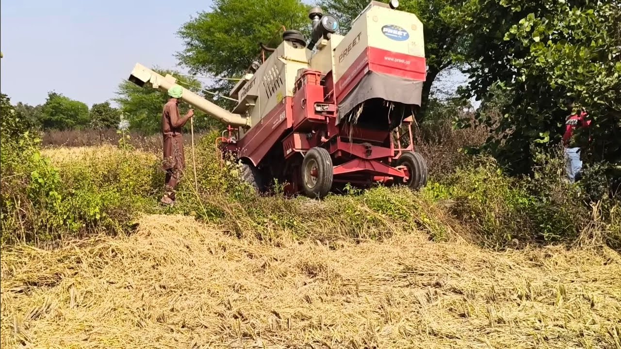 Preet combine harvester and Eicher 368 with full size trolley