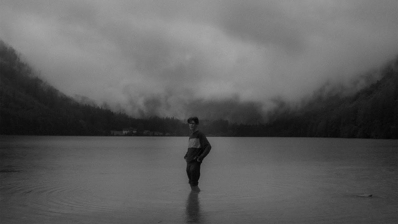 Self portraits in the rain at a lake.