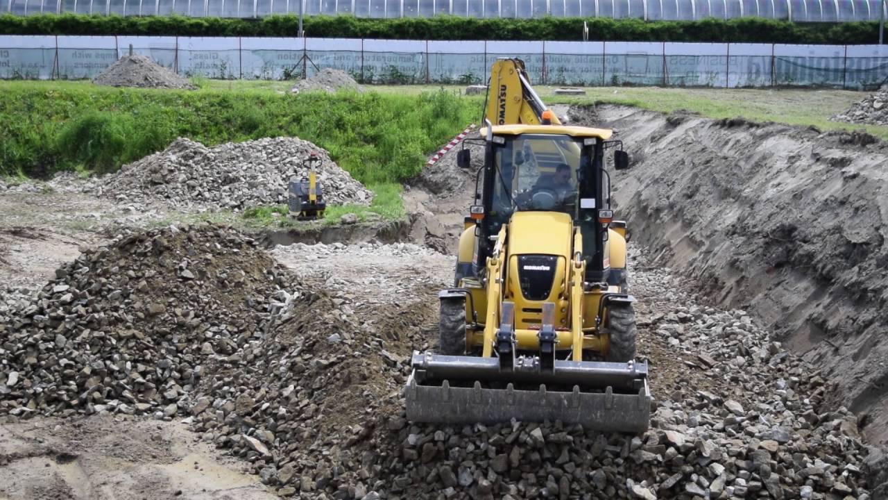 backhoe KOMATSU WB97R at work at Bratislava construction yard