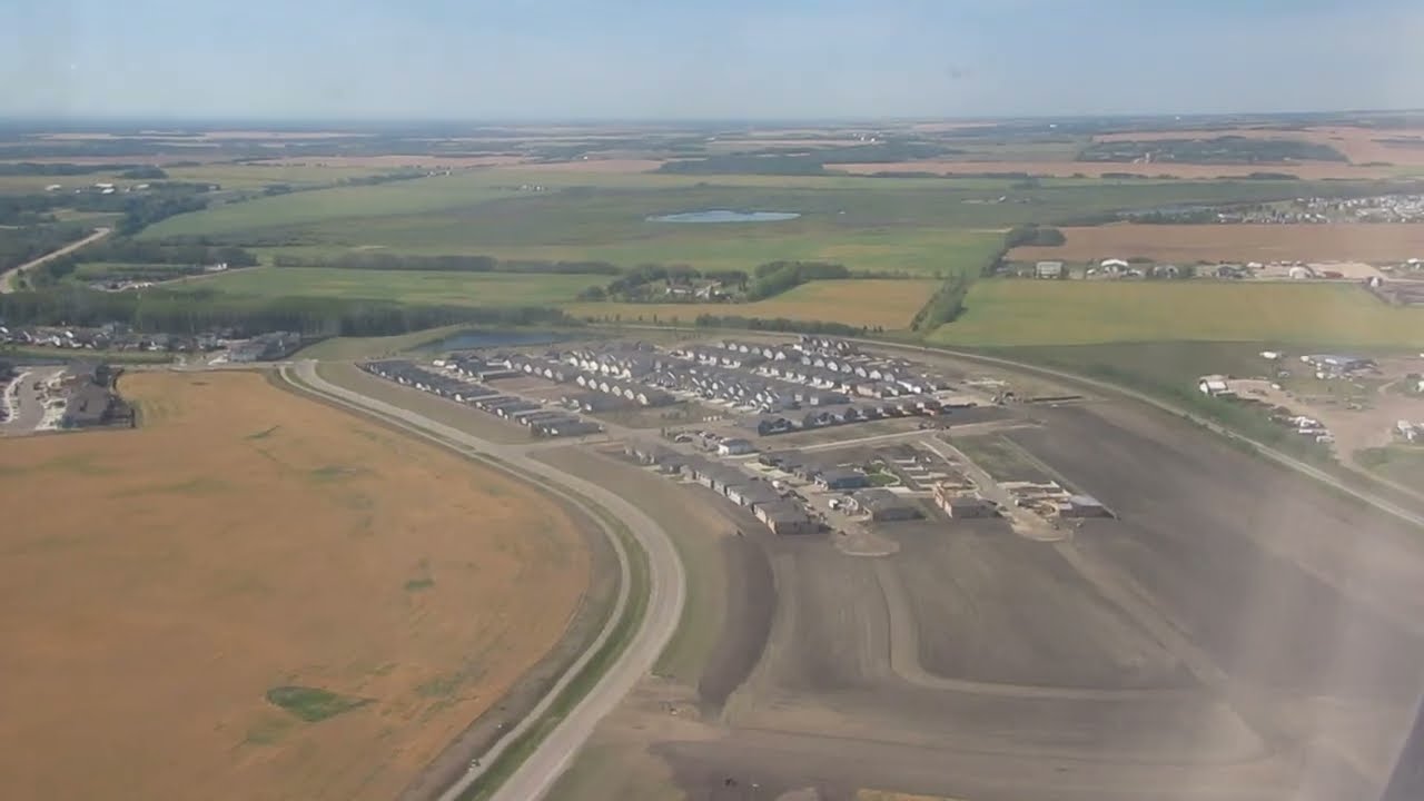 WestJet  de Havilland Canada dash 8-400 landing    at   YQU  Grande Prairie Alberta