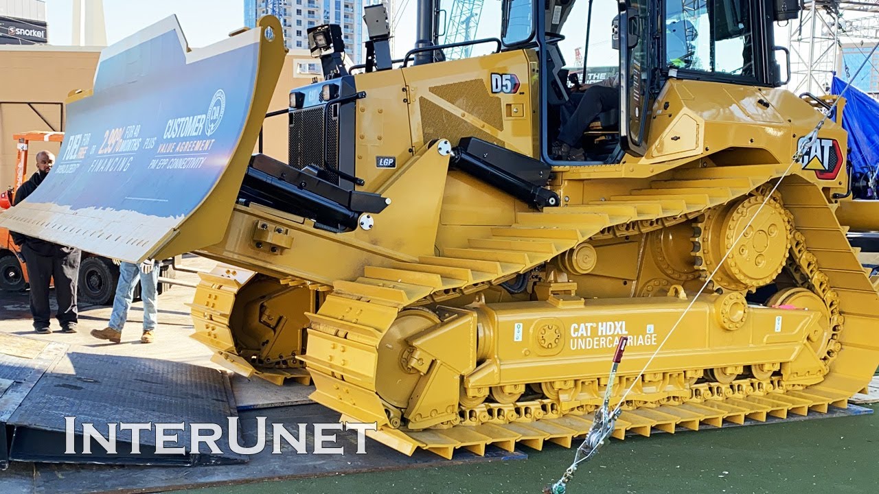 Loading New CAT D5 Dozer on Double Drop Semi Tractor Trailer CONEXPO 2020