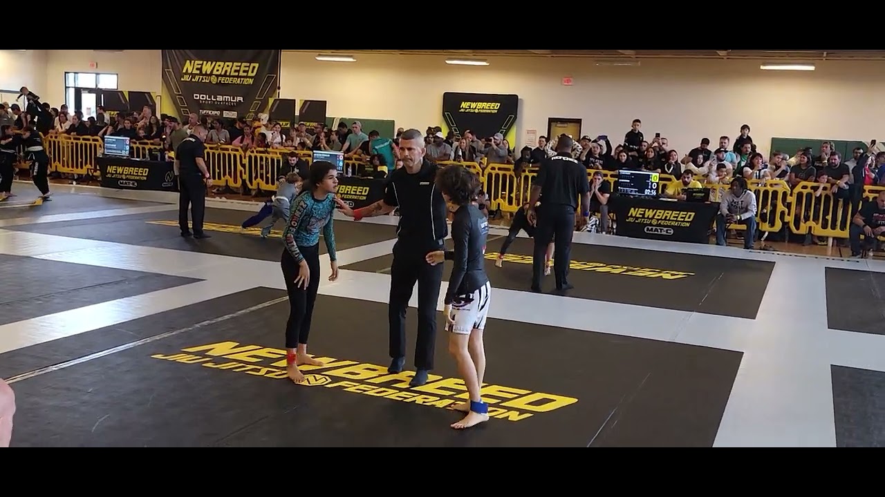 girl vs boy jiu jitsu nogi fight. 1st round in 3 person match.