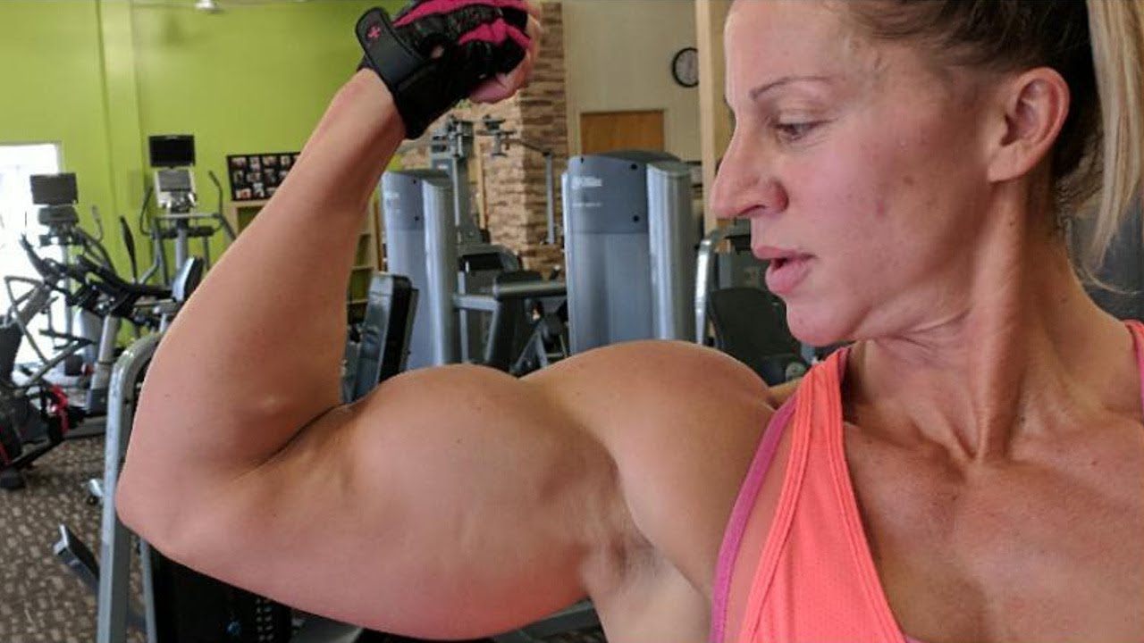 42 years young muscle woman Jennifer Olsem Louwagie with 16 inches biceps - flexing and measuring
