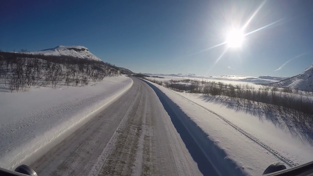 Driving in winter wonderland. Kilpisjärvi, Lappi, Finland.