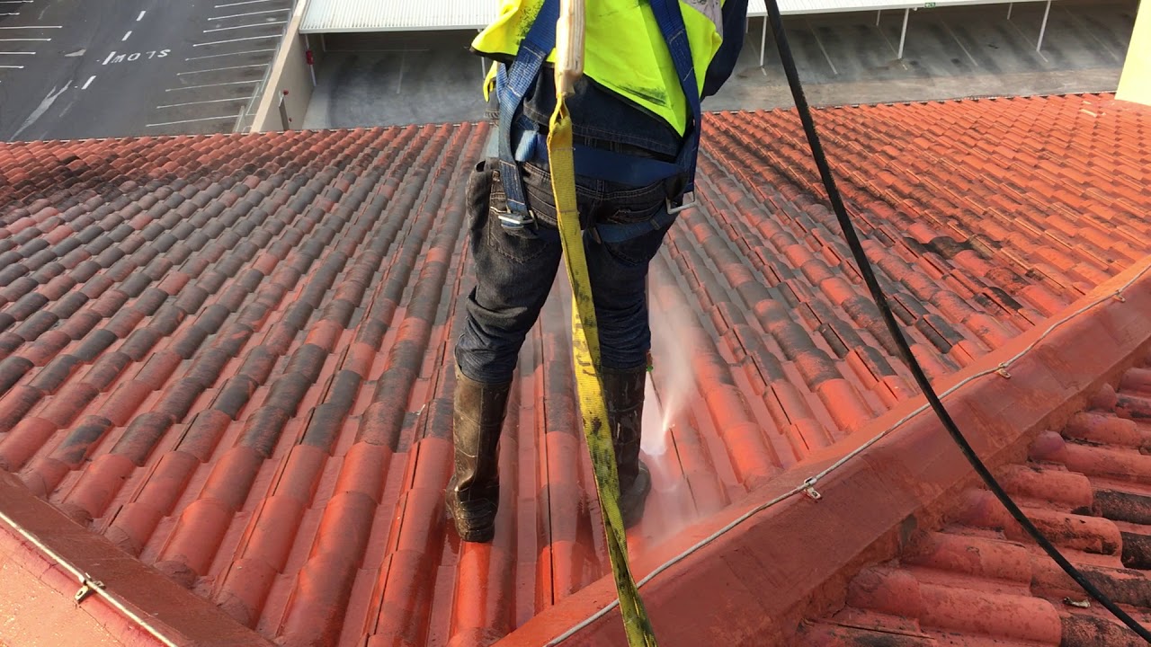 High pressure washing of tile roof
