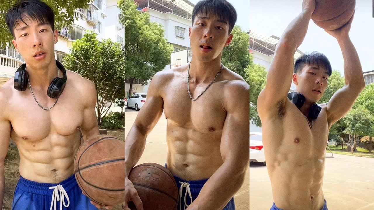 asian muscular teen playing basketball.
