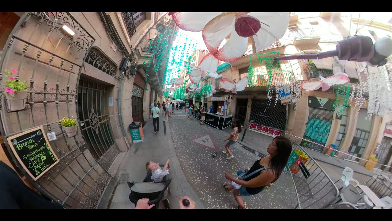 Street festival Barcelona, La Fiesta de Gr&agrave;cia. 360 travel. Father & son exploring Catalunya. Spain.