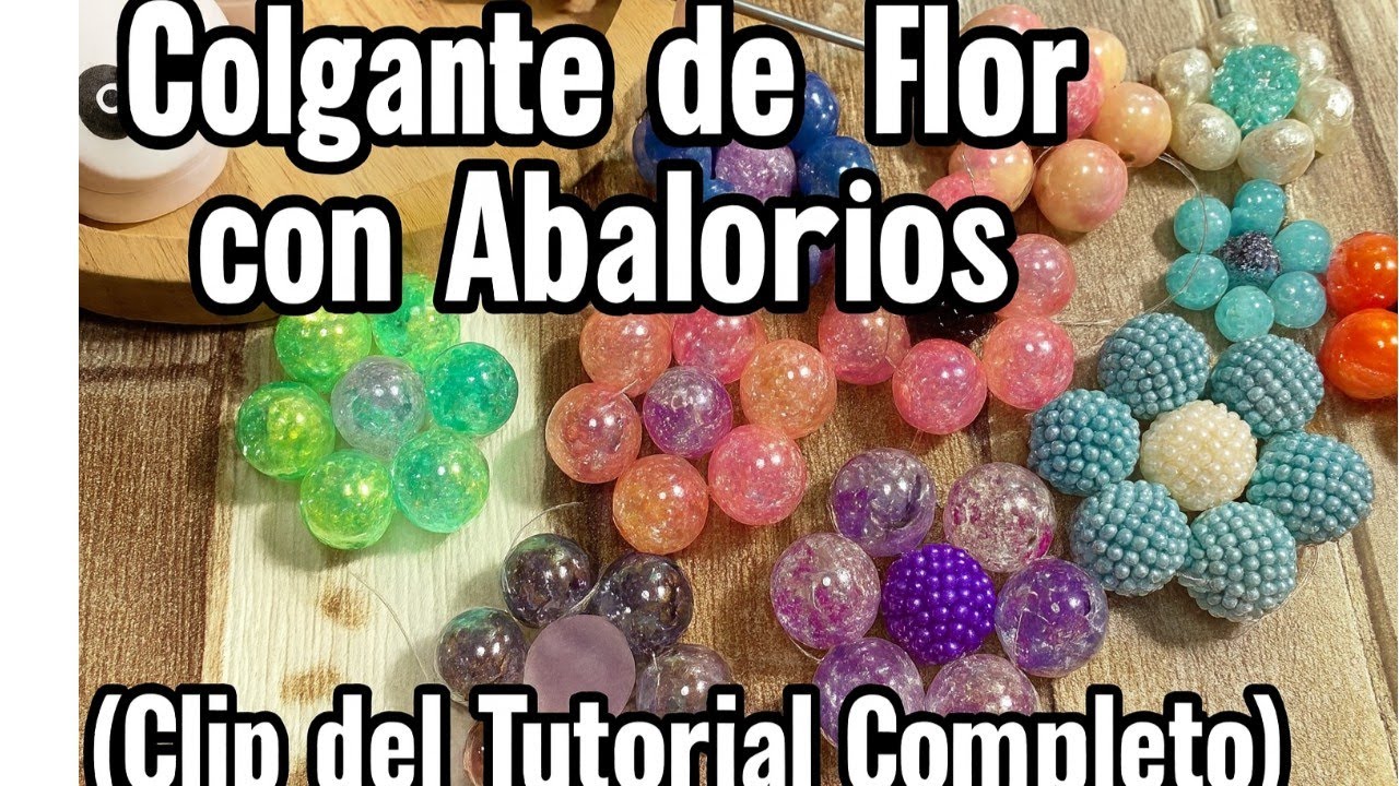 CLIP DEL TUTORIAL DE COLGANTES DE ABALORIOS EN FORMA DE FLORES VIDEO COMPLETO DEJO EL ENLACE