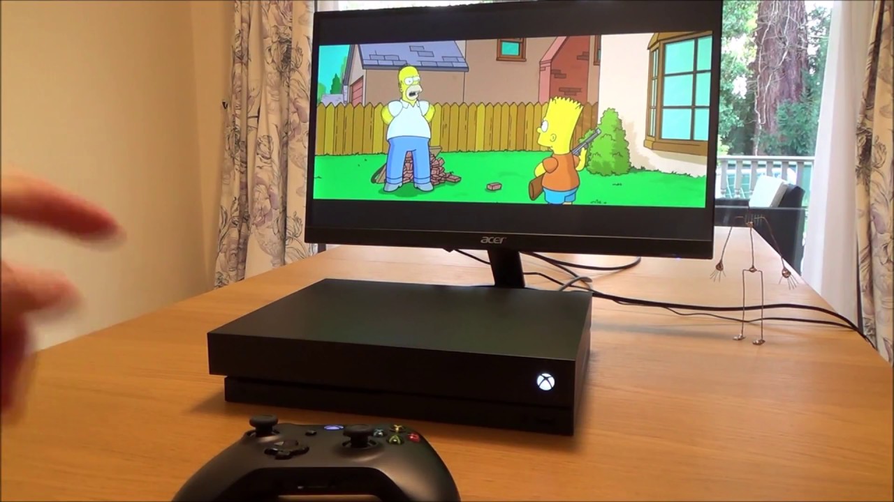 Что происходит, когда вы вставляете DVD в консоль Xbox One X