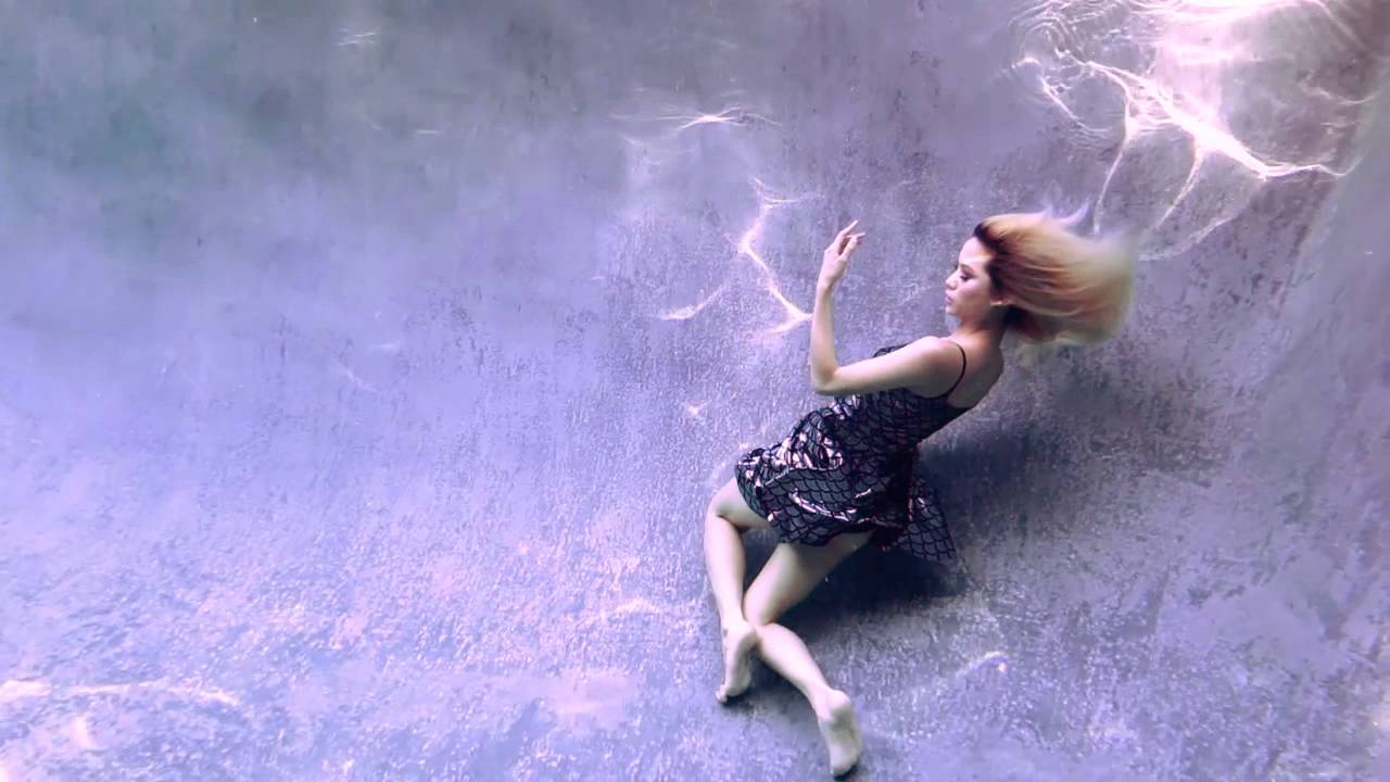 Yuki Ito underwater in a Black Milk Mermaid Skater dress