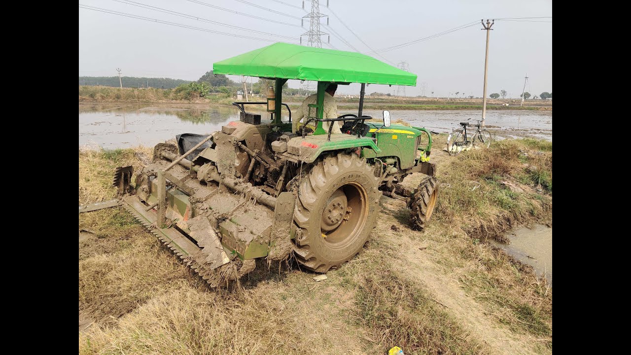 John Deere with Green system pudling leveler Rotovator in mud