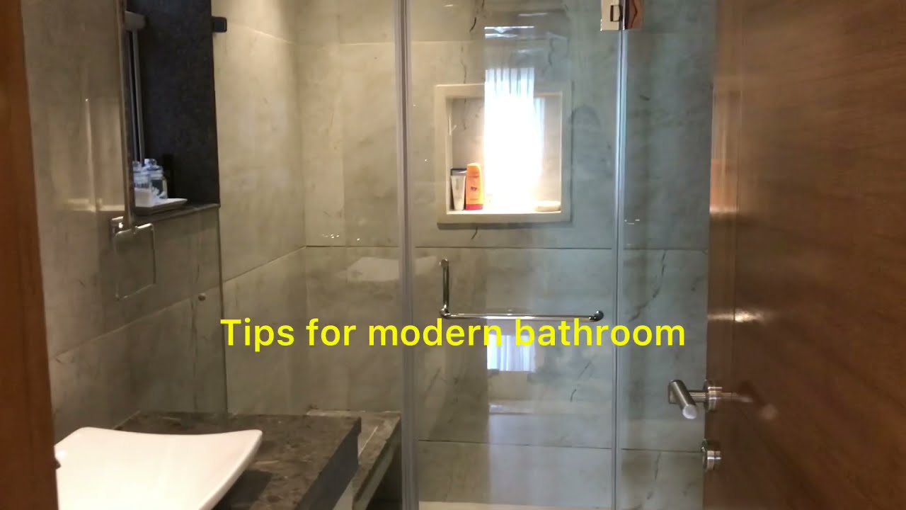 Modern Bathroom Design | BATHROOM INTERIORS |  Kajariatiles | glass partition in bathing area