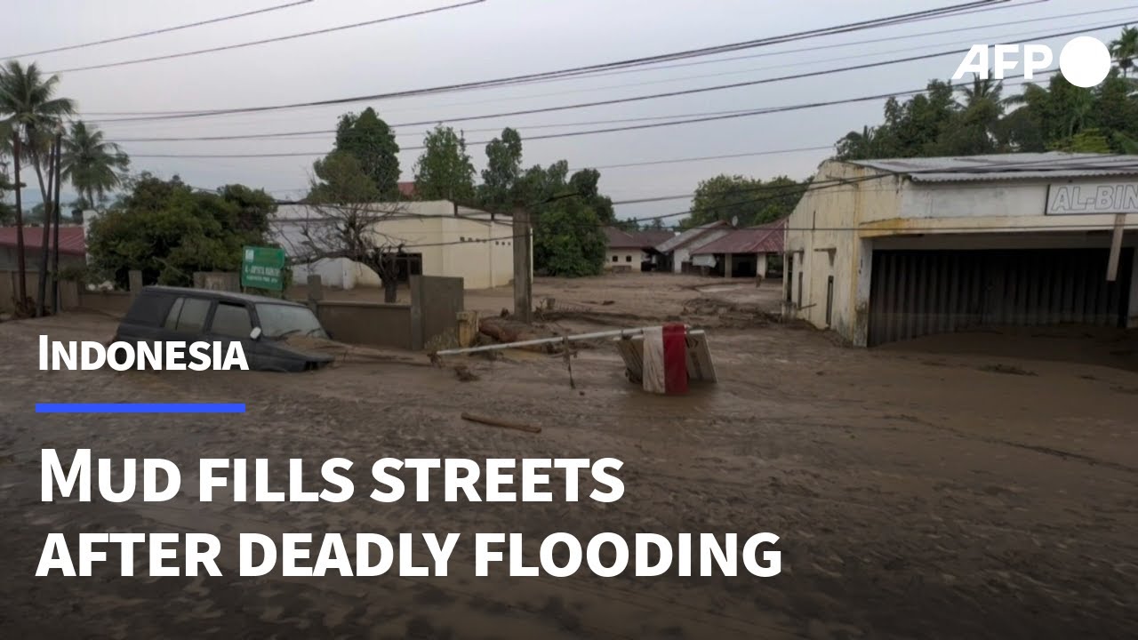 Homes and roads coated in mud after deadly floods hit Indonesia's Aceh | AFP