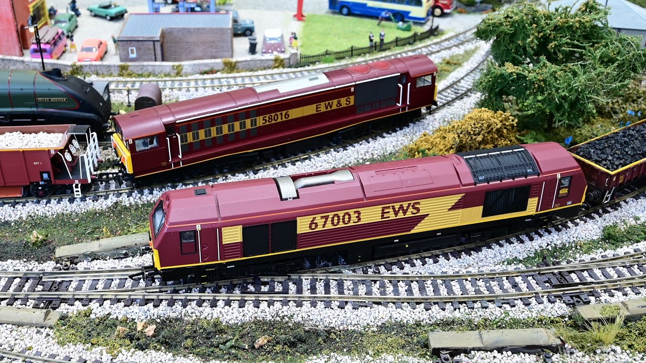 A Class 67 and a Class 58 pulling EWS freight wagons.