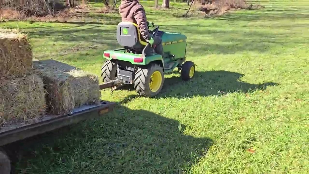 John Deere 240 Hauling Hay Bales