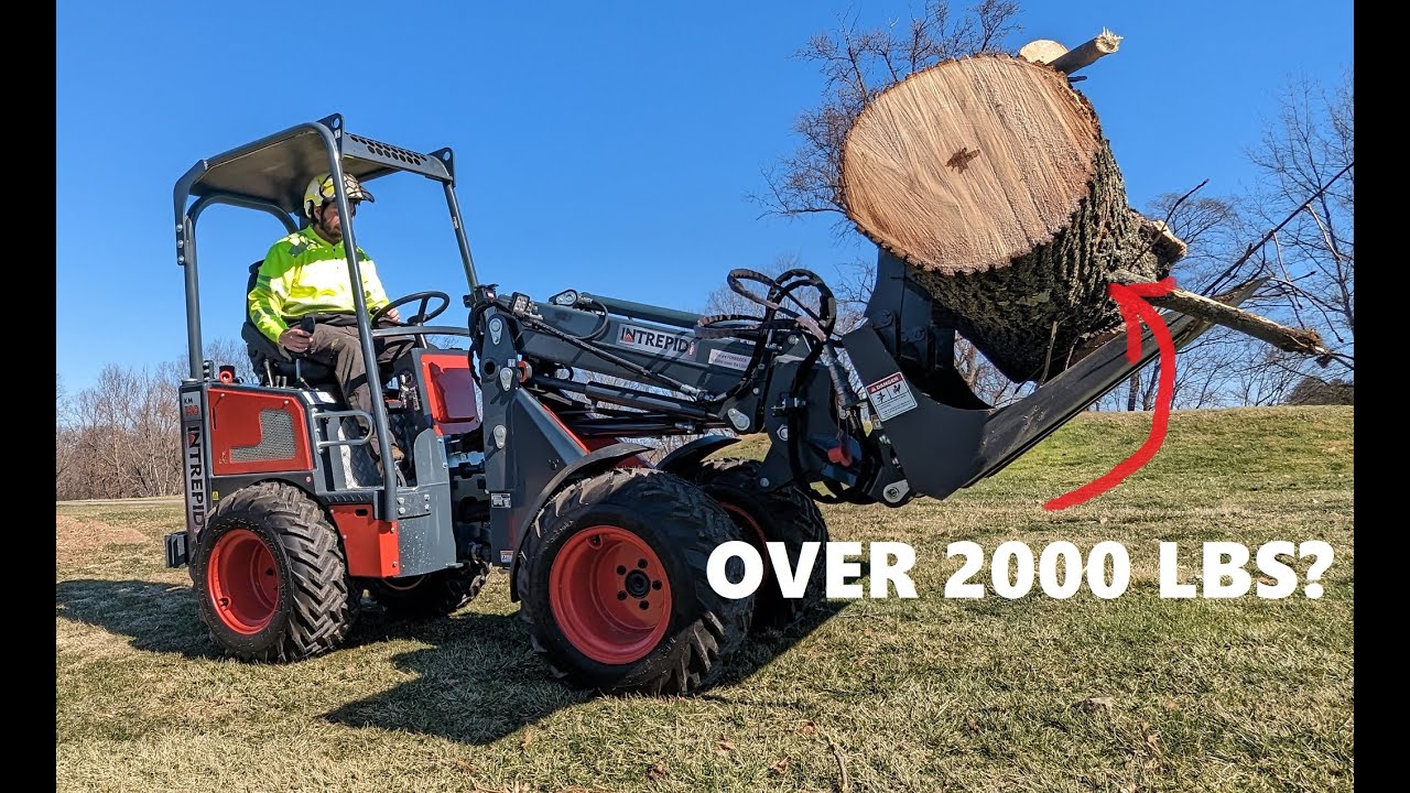 Compact wheel loader action - Intrepid KM130 Tele miniloader with powerful log grapple (tree care)