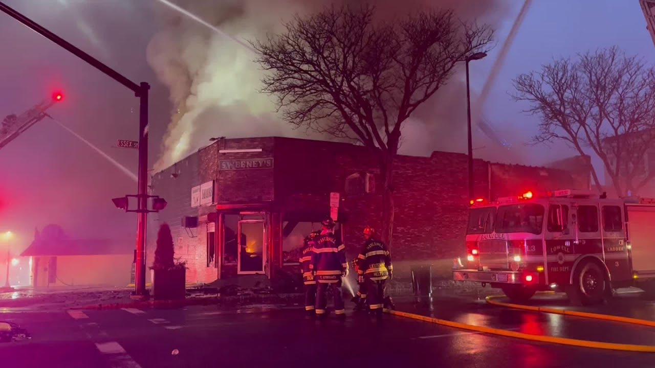 Crews battle fire at Lawrence liquor store