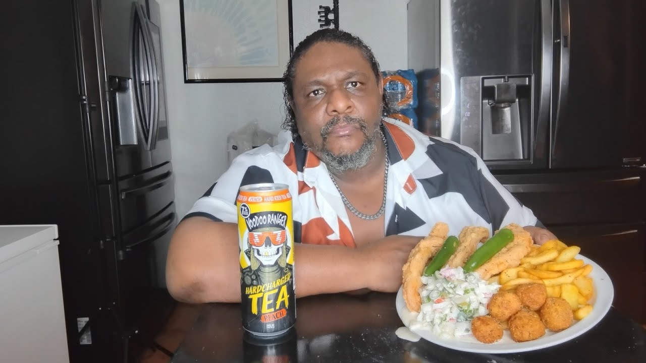 Fried Swai fish and french fries. Drinking a VOODOO RANGER HARD CHARGED PEACH TEA. He followed me