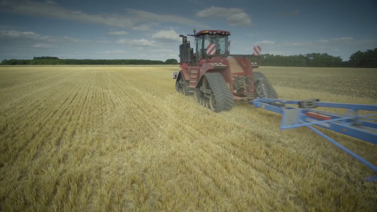 Дисковая борона Lemken 16m, работающая с  Case IH Quadtrac 620