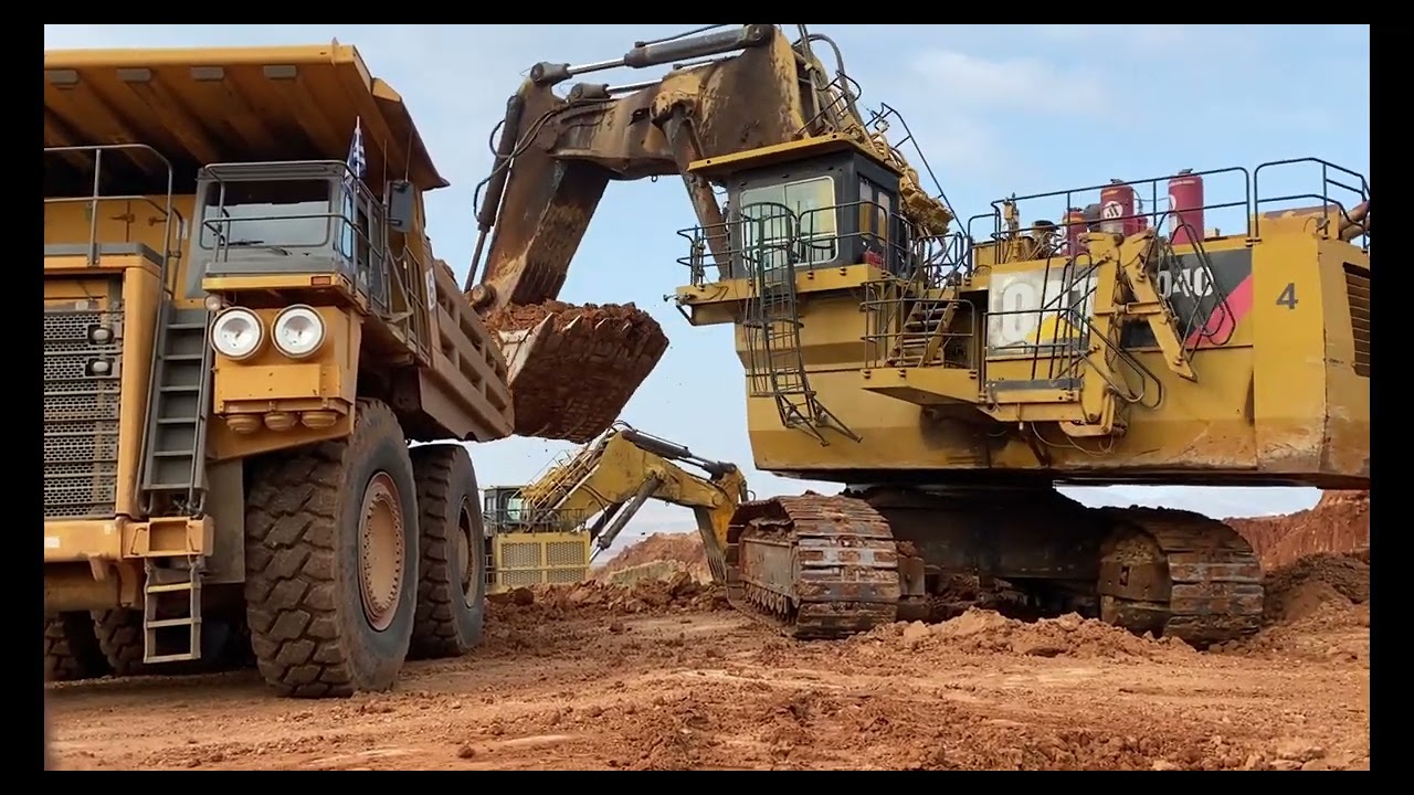 Caterpillar 6040 Massive Excavator Loading Hitachi And Terex Dumpers