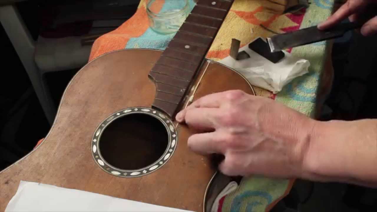 Restoring an antique parlour guitar part 8: filling the crack on the front