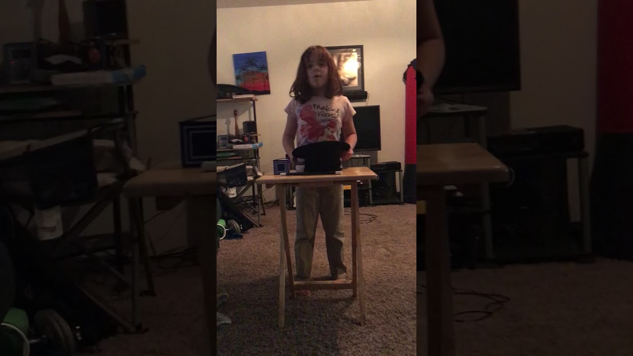 Rexy performs magic trick by making a dice disappear with ideal magic kit