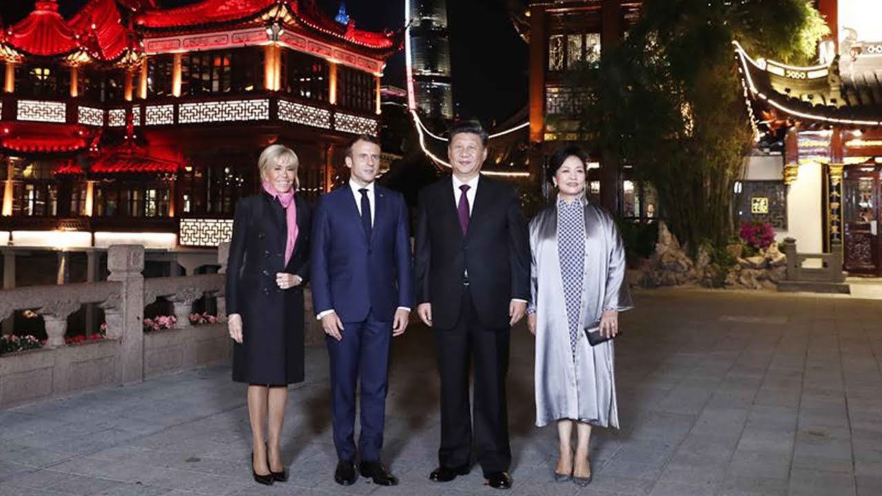 Xi and his wife meet French president and his wife in Shanghai