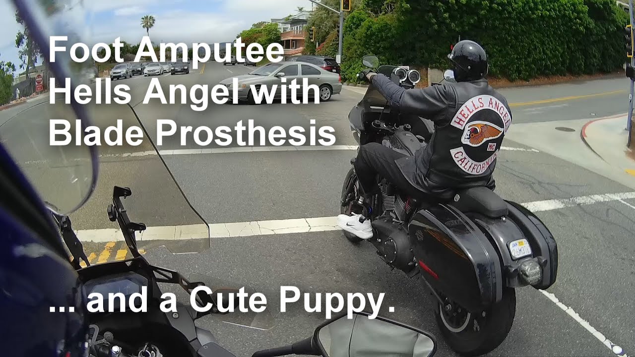 Foot Amputee Hells Angel with Blade Prosthesis... and a Cute Puppy.