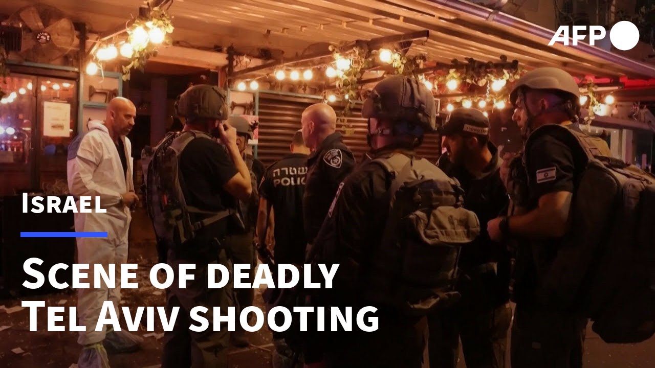 Israeli police and people gather at the scene of Tel Aviv attack | AFP
