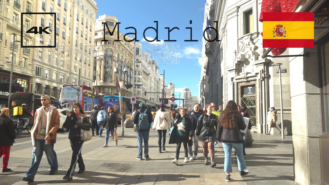 4k Madrid, Spain street tour. Crowded Gran Via street.