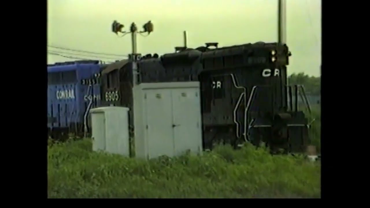 EVENING AT DOLTON JCT. 6/25/82. CHESSIE TRUCK WAITING AT CHESSIE CROSSING! CONRAIL, IHB, MOPAC, L&N!
