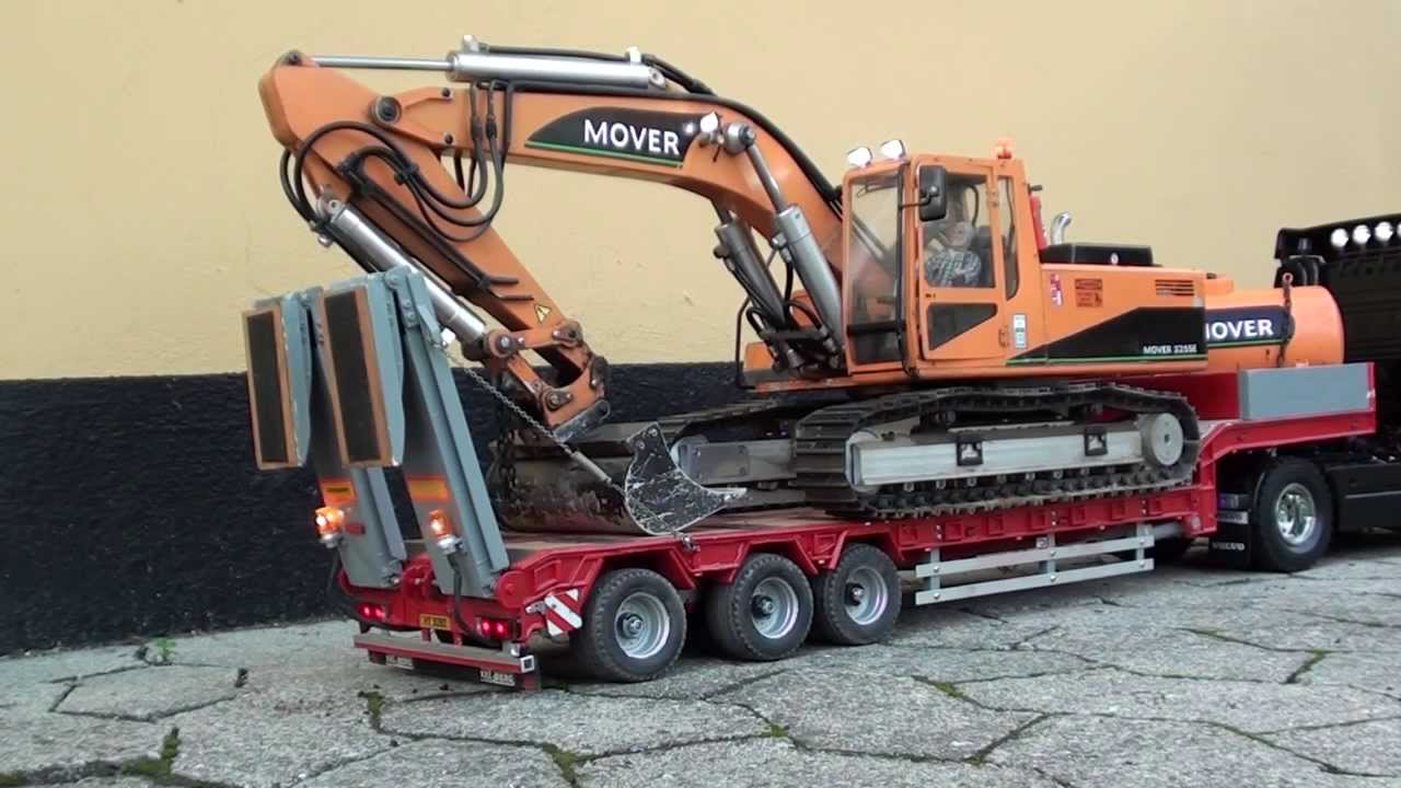 RC Volvo truck transports Excavator