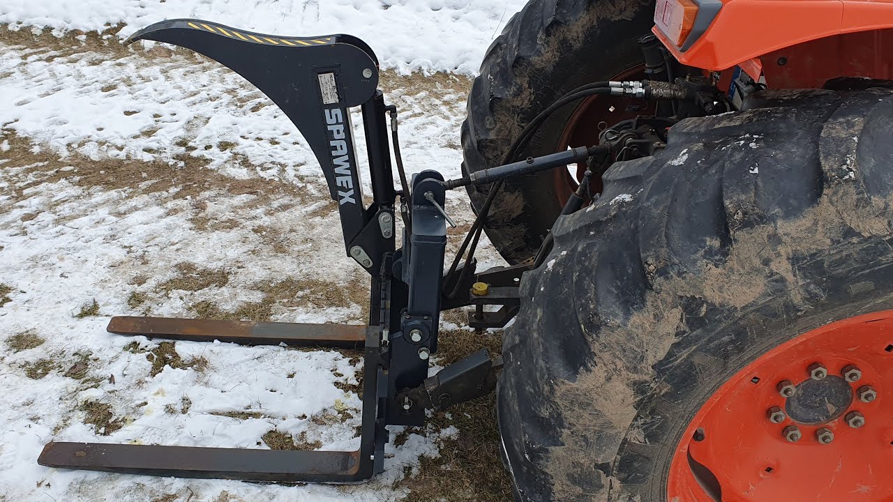 Tractor Grapple Attached To a Kubota M9000 Three-Point Hitch (1/2)