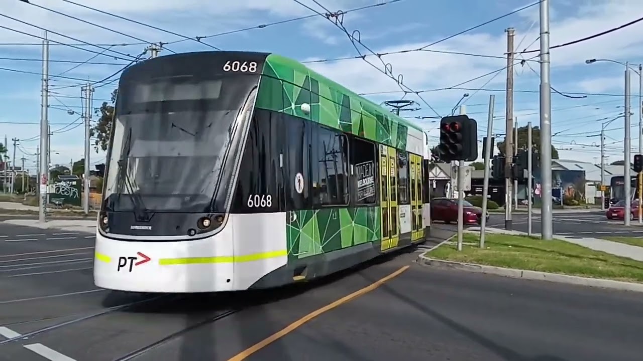 2 E class trams entering New Preston Depot