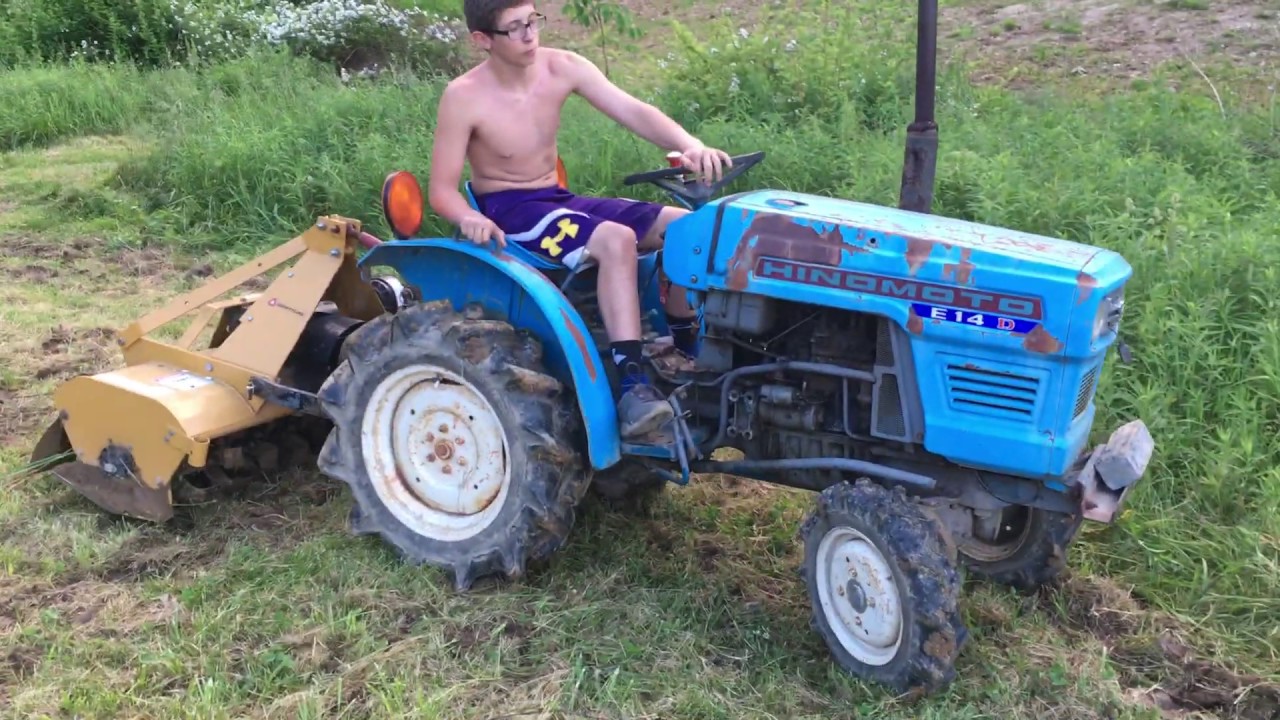 Cultivating potatoes with a Hinomoto E-14 -D