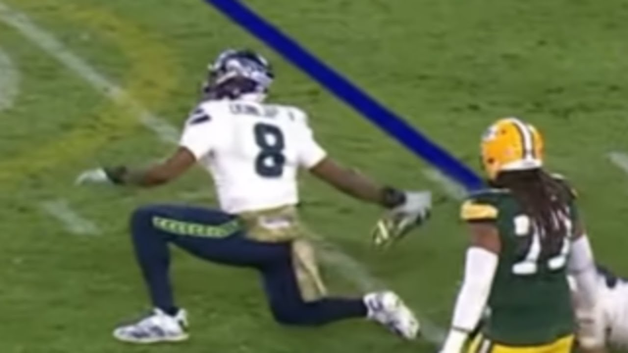 Carlos Dunlap throws a player's shoe across the field