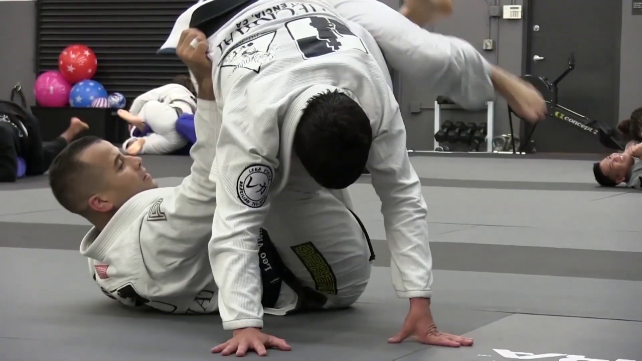 Leka Vieira rolling with Checkmat founder Leo Vieira after being promoted to 5th Degree black belt