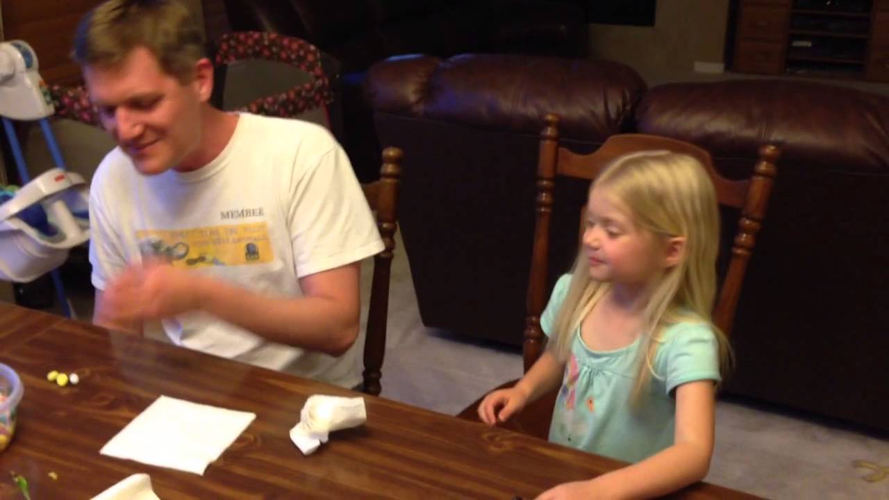 Heidi and her dad trying a vomit flavored jelly bean