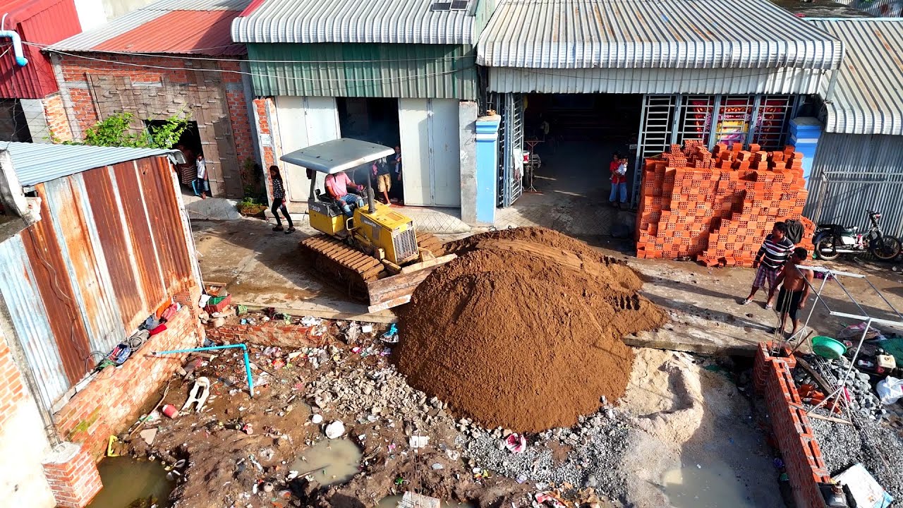 100% Full This project Support by Dozer KOMATSU D20P Truck 5T to pushing sand & drop to Flooded land