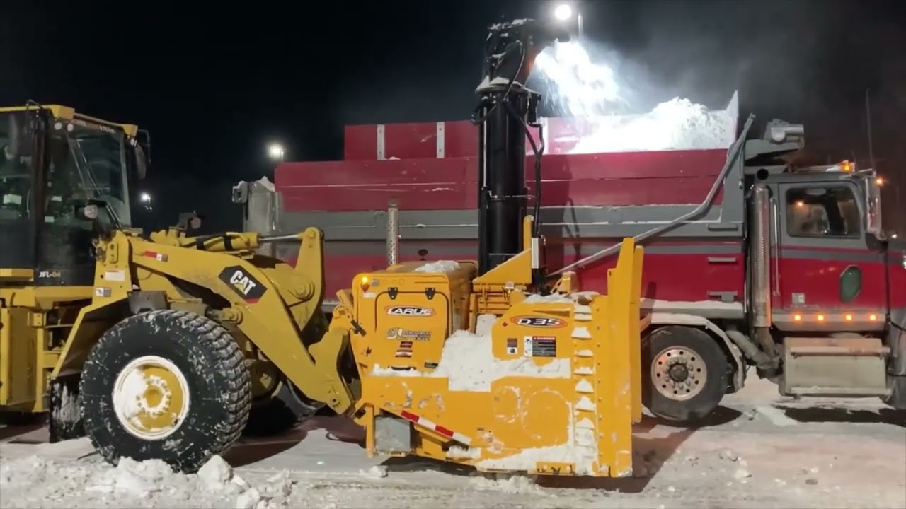Larue D35 loader-mounted snow blower commercial parking clearing and truck loading