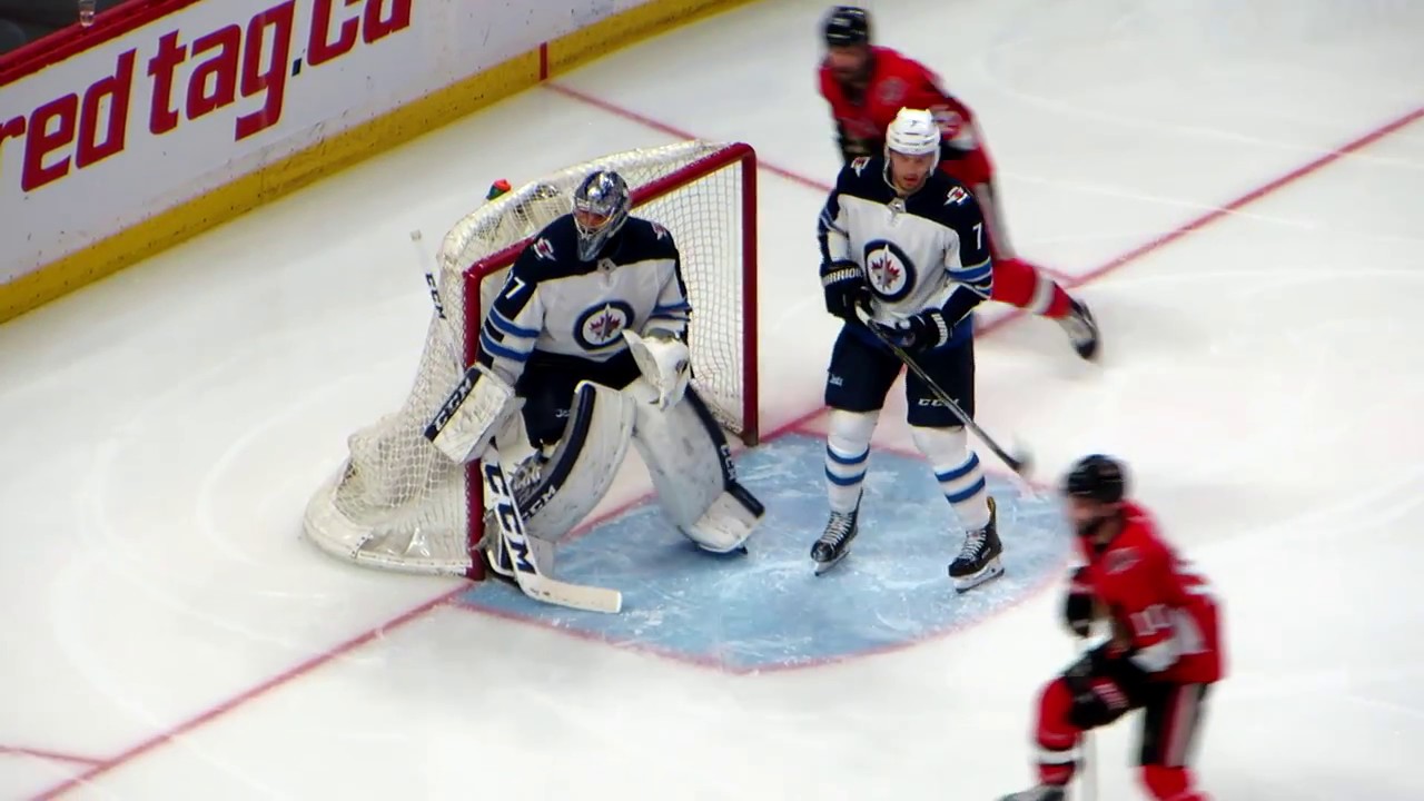Connor Hellebuyck in action during the Jets @ Senators hockey game