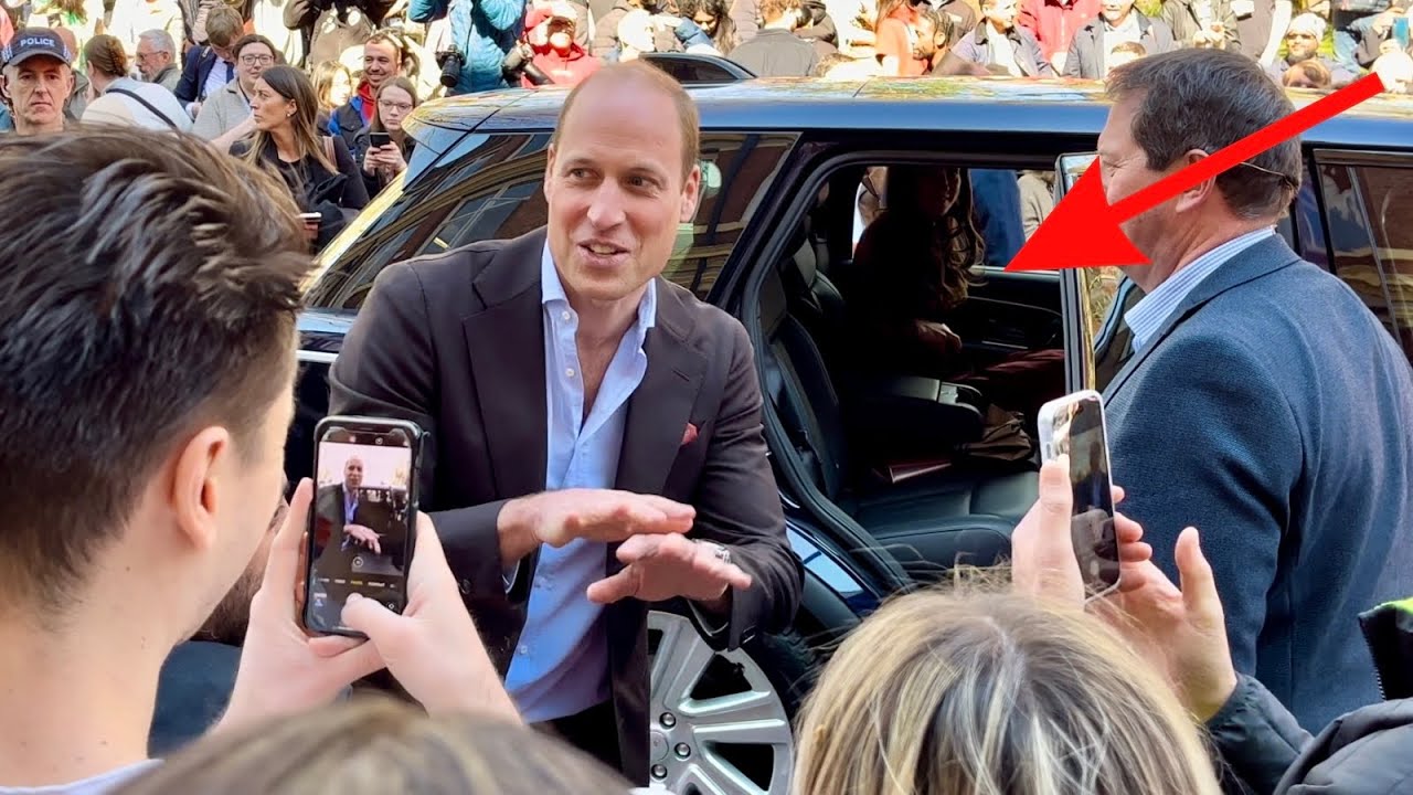 Kate ￼patiently waits for Will while he greets fans!